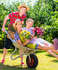 People in a garden with a wheelbarrow, showcasing 4.10/3.50-6 Tires With Heavy Duty Inner Tubes For 4 Wheelers ATVs Go Karts Lawn Mowers.