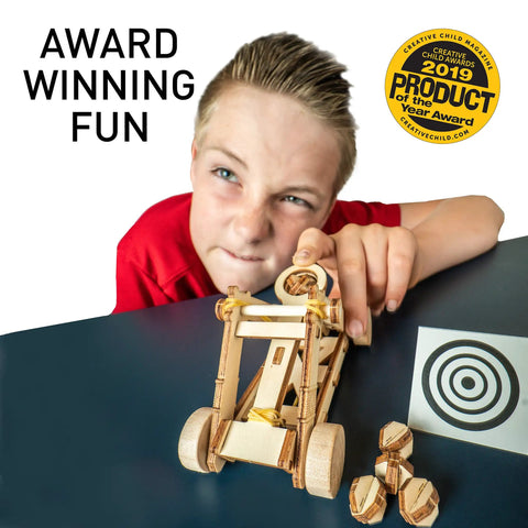 Child playing with Da Vinci Catapult Kit For Kids With Ballista And Bombard, 3D Puzzle Wood Building Toy