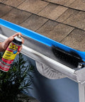 Hella Tough Rubber Sealant Spray Coating That Patches Roof Leaks Quick And Lays Down Flexible Waterproof Armor For Easy Whole House And Garage Fixes In A Six Pack Bundle being used on a roof with visible shingles.