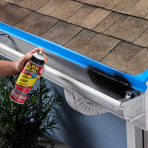 Hella Tough Rubber Sealant Spray Coating That Patches Roof Leaks Quick And Lays Down Flexible Waterproof Armor For Easy Whole House And Garage Fixes In A Six Pack Bundle being used on a roof with visible shingles.