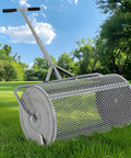 27 Inch Metal Roller Compost Spreader For Lawn And Garden With Adjustable Handle Ideal For Seeding And Even Lawn Growth Heavy Duty Fertilizer Spreader For Yard Work Gray on grass