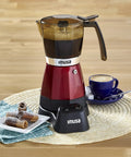 Electric Espresso Moka Maker For 3 To 6 Cups, 48 Oz Capacity, Red seated on a table with coffee cup and cinnamon rolls