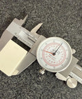 Six Inch Dial Caliper With Dual Metric And SAE Readout, Pro Grade Precision 0.001 Inch Resolution, 150 Mm Scale, Easy Read Dial, Tough Metal Measuring Tool For Quick, Accurate Machining And Shop Tasks on a granite surface