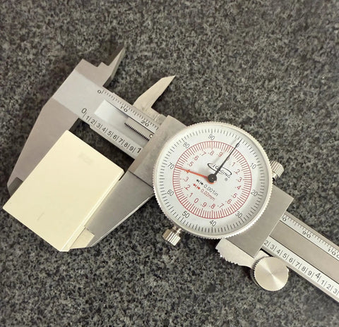 Six Inch Dial Caliper With Dual Metric And SAE Readout, Pro Grade Precision 0.001 Inch Resolution, 150 Mm Scale, Easy Read Dial, Tough Metal Measuring Tool For Quick, Accurate Machining And Shop Tasks on a granite surface