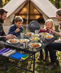 Family using All In One Stainless Steel Camping Mess Kit For 1 To 4 People With Plates, Bowls, Cups, And Full Cutlery Set Plus Carry Bag