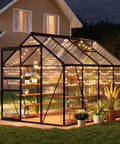 Walk In Polycarbonate Greenhouse With Sliding Door, Built Tough Weatherproof Frame, Adjustable Roof Vent, Gutter System shown at night