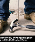 Telescoping Magnetic Pickup Tool With A 25 Pound Pull Stainless Steel Magnet lifting a hammer near feet