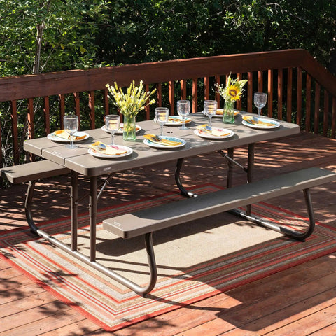 Six Foot Folding Picnic Table With Classic Rugged Steel Frame Seats Eight UV Protected Top Weather And Rust Resistant Flat Fold For Easy Stow And An Umbrella Hole For Backyard Hangouts on a deck set for dining