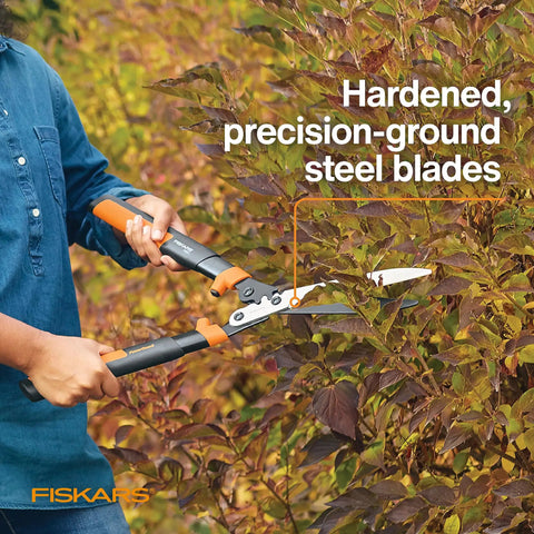 Person using 23 Inch Hedge Shears With PowerGear2 Technology That Multiplies Power For Less Effort on shrub with SoftGrip handles