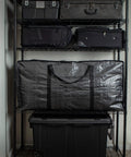 XXL 68.5 Gallon Heavy Duty Storage Bags Two Pack With Mega Strong Wrap Around Handles on shelf, folded and reusable.