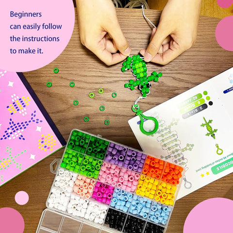 Person crafting with Bead Pets Kit For Kids And Kid Friendly DIY Jewelry And Keychain Craft With 800 Plus Colorful Pony Beads 65 Feet Cord 10 Animal Patterns And Beginner Friendly Instructions Includes Needles And Storage Box, showing green lizard design.