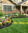 House with garden bordered by Durable 33ft Galvanized Steel Landscape Edging Kit, 10 Pack, 5 Inch High Metal Border, black finish