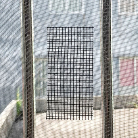 Window Screen Repair Kit 2 Inch By 16.5 Foot Fiberglass Mesh Tape With 3 Layer Strong Adhesive And Waterproof Patch installed on windows.