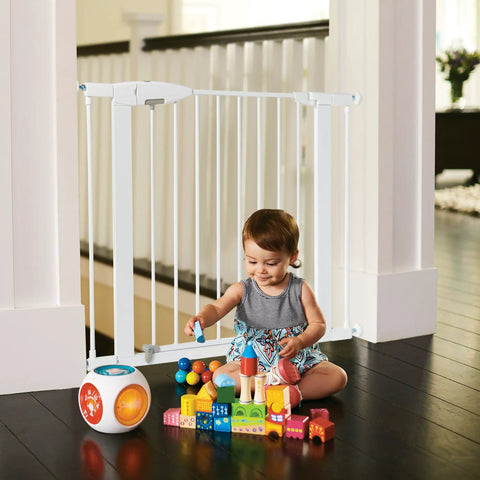 Child playing near 11 Inch White Baby Gate Extension For Easy Close Metal, Auto Close Metal, Safe Step With Trip Guard, It Fits And Click Lock Gates