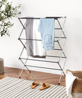 Hassle Free Top Shelf Foldable Indoor Clothes Drying Rack Heavy Duty Steel Laundry Stand, chrome finish with clothes drying.