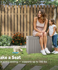 Woman sitting on 50 Gallon Outdoor Storage Box Weatherproof Resin Deck Box With Reinforced Lid That Doubles As A Patio Bench And Side Table