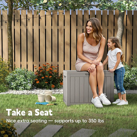 Woman sitting on 50 Gallon Outdoor Storage Box Weatherproof Resin Deck Box With Reinforced Lid That Doubles As A Patio Bench And Side Table