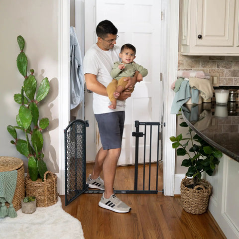 Walk Through Baby And Pet Gate Easy To Use For Doorways And Stairways No Drill Pressure Mount Adjustable, man holding baby near gate