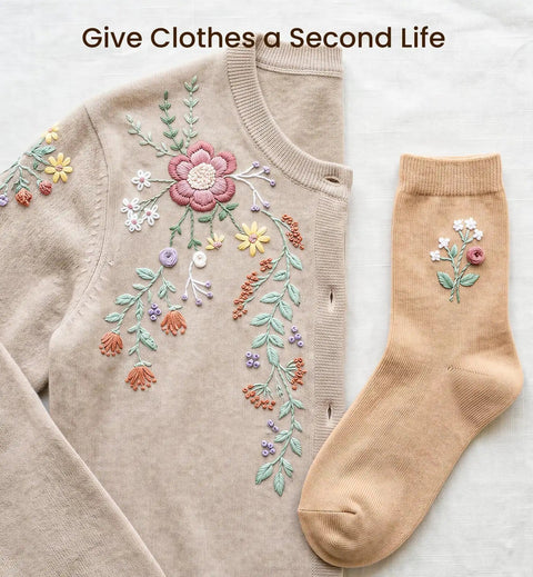 Beige sweater and sock with floral embroidery, showcasing clothing repair and embellishment.