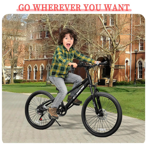 Child riding Kids Mountain Bike 20 To 24 Inch With Front Suspension 7 Speeds Dual Disc Brakes Anti Slip Butyl Tires. Building background.
