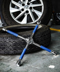 Beefy 16 Inch Universal Lug Wrench Four Way Tire Iron With Non Slip Handle For Cars Light Trucks SUVs Vans And RVs Includes 17mm 19mm 21mm And 22mm Lug Sizes Heavy Duty Blue Finish Built To Last on garage floor with tire in background