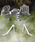 5 Piece Skeleton Ground Breaker Yard Prop Set For Halloween Decorations among tombstones on grass