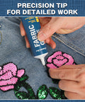 Applying Clear Heavy Duty Fabric Glue for Clothes and Crafts on denim with sequin patches, precision tip shown