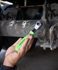 Person using Slack Adjuster Tool And Wrench For Semi Trucks With Angled Head For Easy Air Brake Adjustments under truck