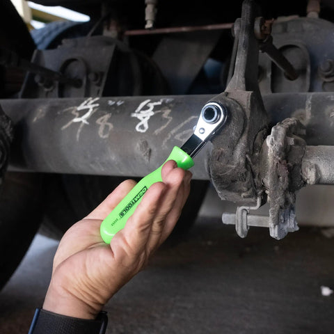 Person using Slack Adjuster Tool And Wrench For Semi Trucks With Angled Head For Easy Air Brake Adjustments under truck