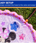 Minnie Mouse Splash Pad For Kids With Built In Sprinklers, The Sickest Outdoor Water Toy For Summer Fun, Disney Pool Party Essential For Ages 1 And Up, Pink Floral Pattern, Quick Setup For Nonstop Splash with hose connected on lawn.