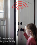 Child near door using 6 Pack Door And Window Alarm System With 120dB Siren And Wireless Chime for home security, white sensor visible