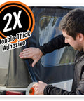 Man applying Heavy Duty Double Thick Black Duct Tape 1.88 Inch By 12 Yard Roll for indoor and outdoor use on vehicle roof