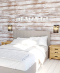 Rustic Tree Sconce Wall Light With Amber Flake Glass, dimmable, flanking a bed in a cozy room with wood-paneled walls.