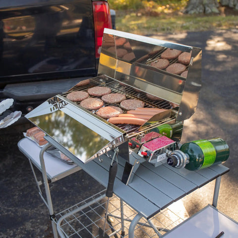Portable Grill Table With Tons Of Prep Space For Camping, Tailgating, Picnics, And Boating, shown with grill and propane tank.