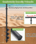Post Hole Digger Hand Auger Spiral Drill For Planting with non-slip T-handle shown vertically on sandy beach background.