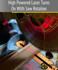Delmar Tools miter saw laser guide attached to a saw; bright red laser line on wood; Delmar Tools logo visible