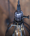 Close-up of socket and wire cage shade for Industrial Pulley Wall Sconce Kit With Wire Cage Shade And Pipe Bracket Plug In 10 Inch Cord On Off Switch And Edison LED Bulb Included Black Pendant Light For Living Room Bar Kitchen