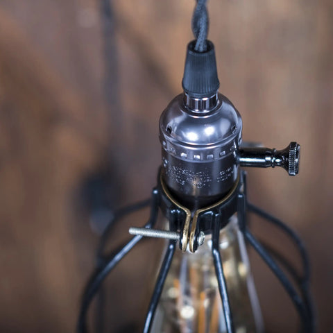 Close-up of socket and wire cage shade for Industrial Pulley Wall Sconce Kit With Wire Cage Shade And Pipe Bracket Plug In 10 Inch Cord On Off Switch And Edison LED Bulb Included Black Pendant Light For Living Room Bar Kitchen