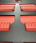 Close-up of Milwaukee Packout Wall Mounting Plate Dope Metal Base for Toolboxes Built Tough. Visible red brackets, rugged surface.