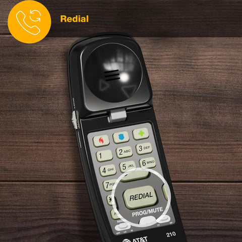 Close-up of Straight Up Reliable Trimline Corded Landline Phone showing redial button on keypad, black finish.