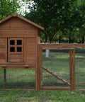 80 Inch Two Tier Chicken Coop With Nest Box Run And Ramp in a garden setting