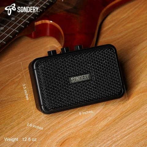 Ultra Portable 5W Mini Guitar Amp For Electric Guitars With Two Speakers And Rechargeable Battery on a wooden surface.