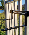 Side view of Universal Adjustable 20 Inch Planter Box Bracket Kit With 2 Heavy Duty Bottom Brackets on spindled deck railing