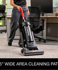 Heavy Duty Commercial Upright Vacuum Cleaner Featuring A Massive 15 Inch Wide Cleaning Path That Legit Crushes Carpet Dirt And Ground In Grime CRI Certified Beast Mode For Pro Cleaners in an office setting.