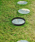 Round Stepping Stone Mold For Concrete Pathways Reusable Plastic Paver Forms DIY Garden Walkway Maker placed on grass