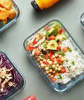 Top view of Five Pack 36 Oz Glass Meal Prep Containers with Snap Lock Lids, filled with assorted meals and ingredients.