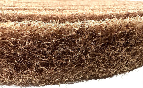 Close-up of 1 Inch Aluminum Oxide Non Woven Cut And Polish Roll, 30 Foot Length, Medium Grit 7440, showing texture and material detail.