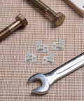 Heavy Duty Spring Clips With Soft Rubber Design, 100 Pack S Clips For Secure Sofa Spring Fixation, shown with tools on a woven mat