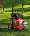 Electric Drain Snake Auger With 4 In 1 Cutting Head And Steel Core Cable for clearing clogs, displayed on grass with accessories.