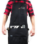Deluxe Waxed Canvas Tool Apron For Men And Women With Removable Padded Straps And Dual Hammer Loops worn by person, front view